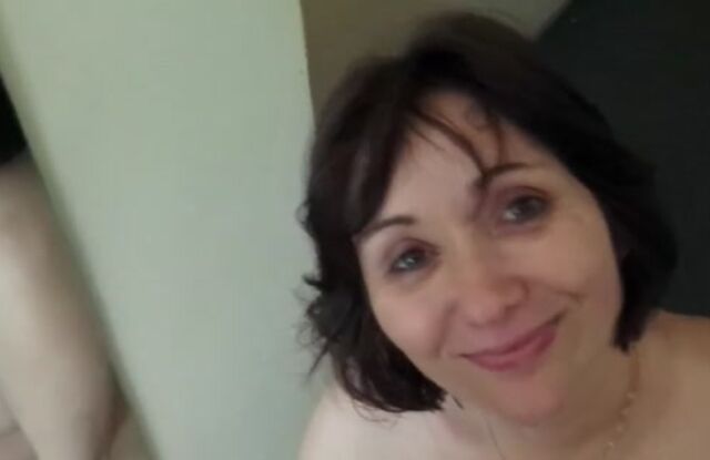 Son surprises mature mom with a camera as she gives him a quiet blowjob